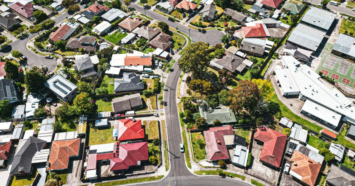 Aerial view of an Australian suburban neighbourhood showing rows of homes and rooftops